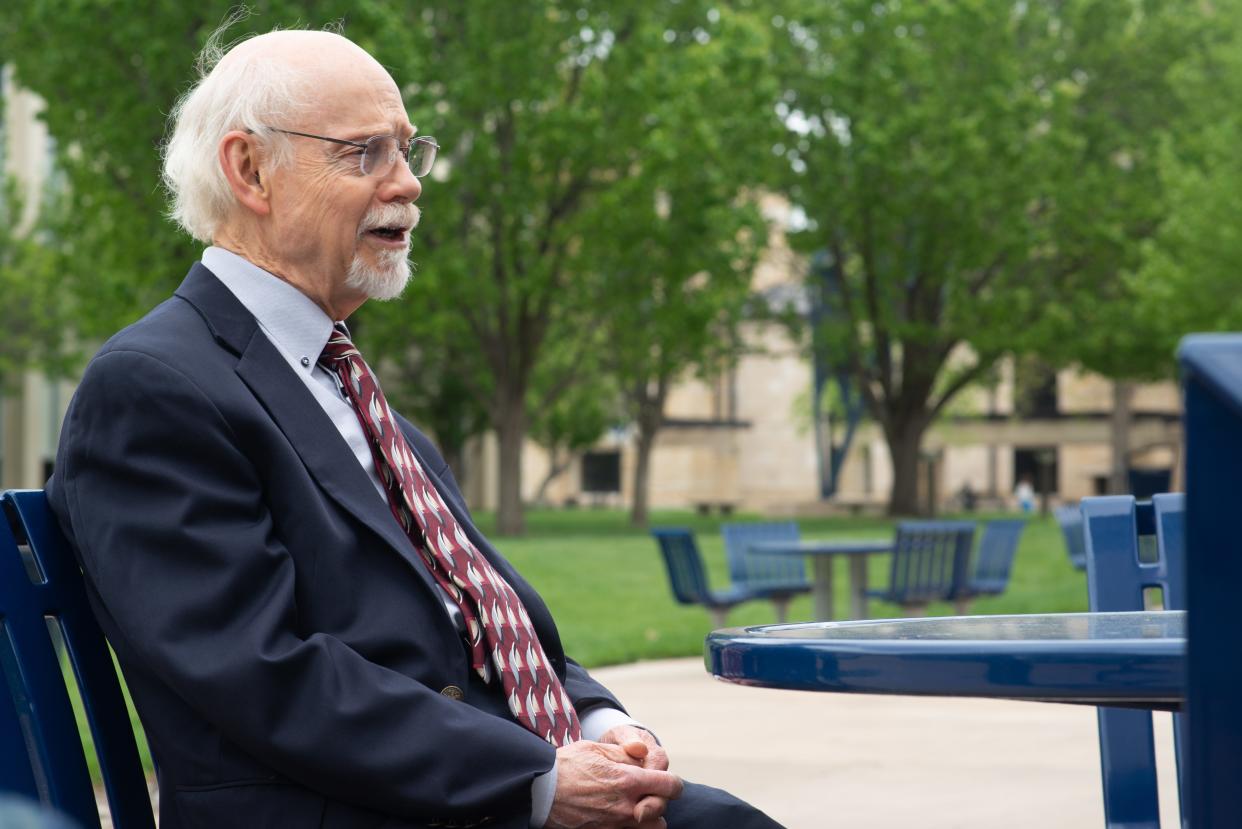 Washburn law professor Myrl Duncan reflects on his career and humble upbringing Tuesday afternoon outside of Memorial Union.