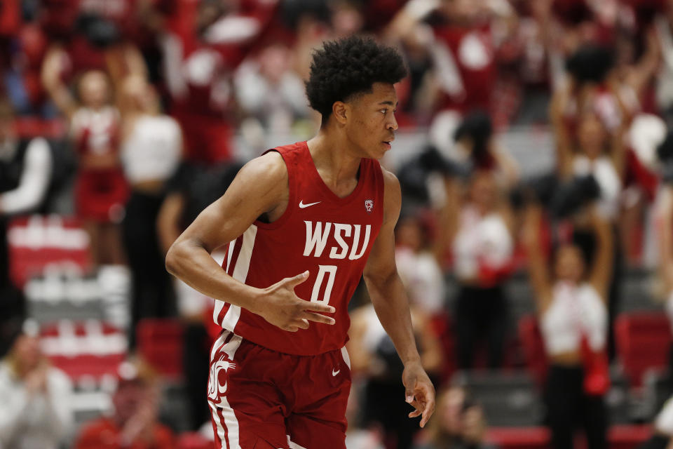Washington State forward Jaylen Wells gestures after scoring during the first half of an NCAA college basketball game against UCLA, Saturday, March 2, 2024, in Pullman, Wash. (AP Photo/Young Kwak)