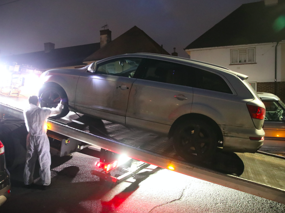 Police remove a car from the scene (Picture: PA)