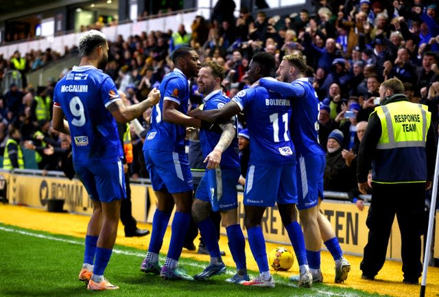 Eastleigh’s Chris Maguire celebrates with his team-mates after making it 1-1 at Newport