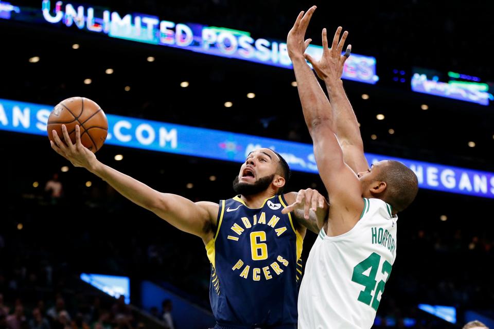 Apr 17, 2019; Boston, MA, USA; Indiana Pacers point guard Cory Joseph (6) takes a shot while guarded by Boston Celtics center Al Horford (42) during the first half in game two of the first round of the 2019 NBA Playoffs at TD Garden. Mandatory Credit: Greg M. Cooper-USA TODAY Sports