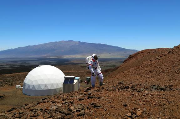 A HI-SEAS crew member walks in a spacesuit on EVA’s during the 2013 HI-SEAS simulated space mission in Hawaii.