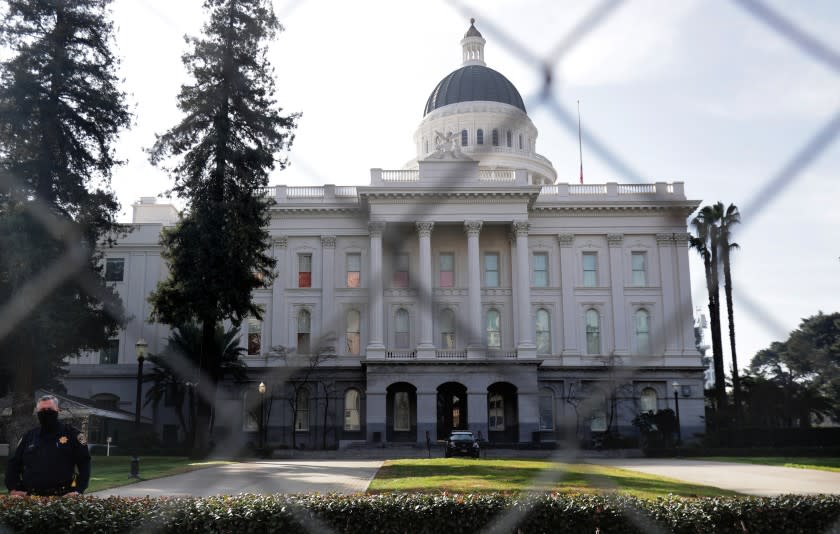 A large metal fence now surrounds the Capitol building as many prepare for possible civil unrest by pro-Trump supporters