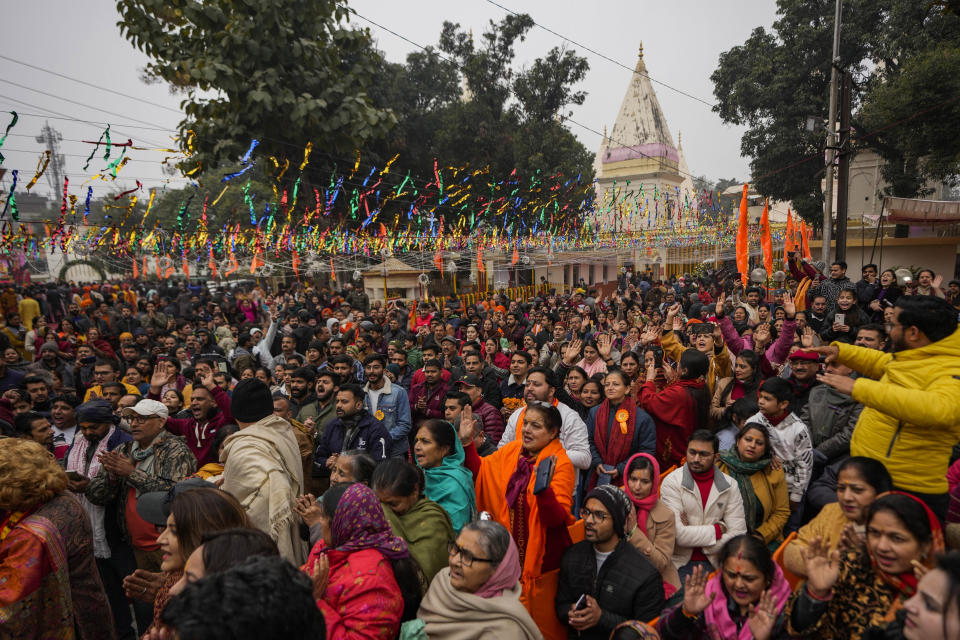 Hindu devotees gather at Raghutnath temple in Jammu, India, to watch a live telecast of the opening of a temple dedicated to Hindu deity Lord Ram, in Ayodhya, Monday, Jan.22, 2024. Indian Prime Minister Narendra Modi on Monday opened a controversial Hindu temple built on the ruins of a historic mosque in the holy city of Ayodhya in a grand event that is expected to galvanize Hindu voters in upcoming elections. (AP Photo/Channi Anand)