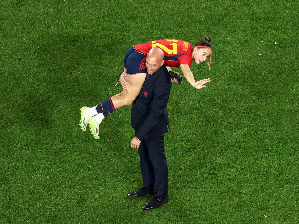 President of the Spanish Football Federation Luis Rubiales carrying Spain's Athenea del Castillo Beivide on his shoulder after the team won the 2023 Women's World Cup final football against England at Stadium Australia in Sydney on August 20, 2023.