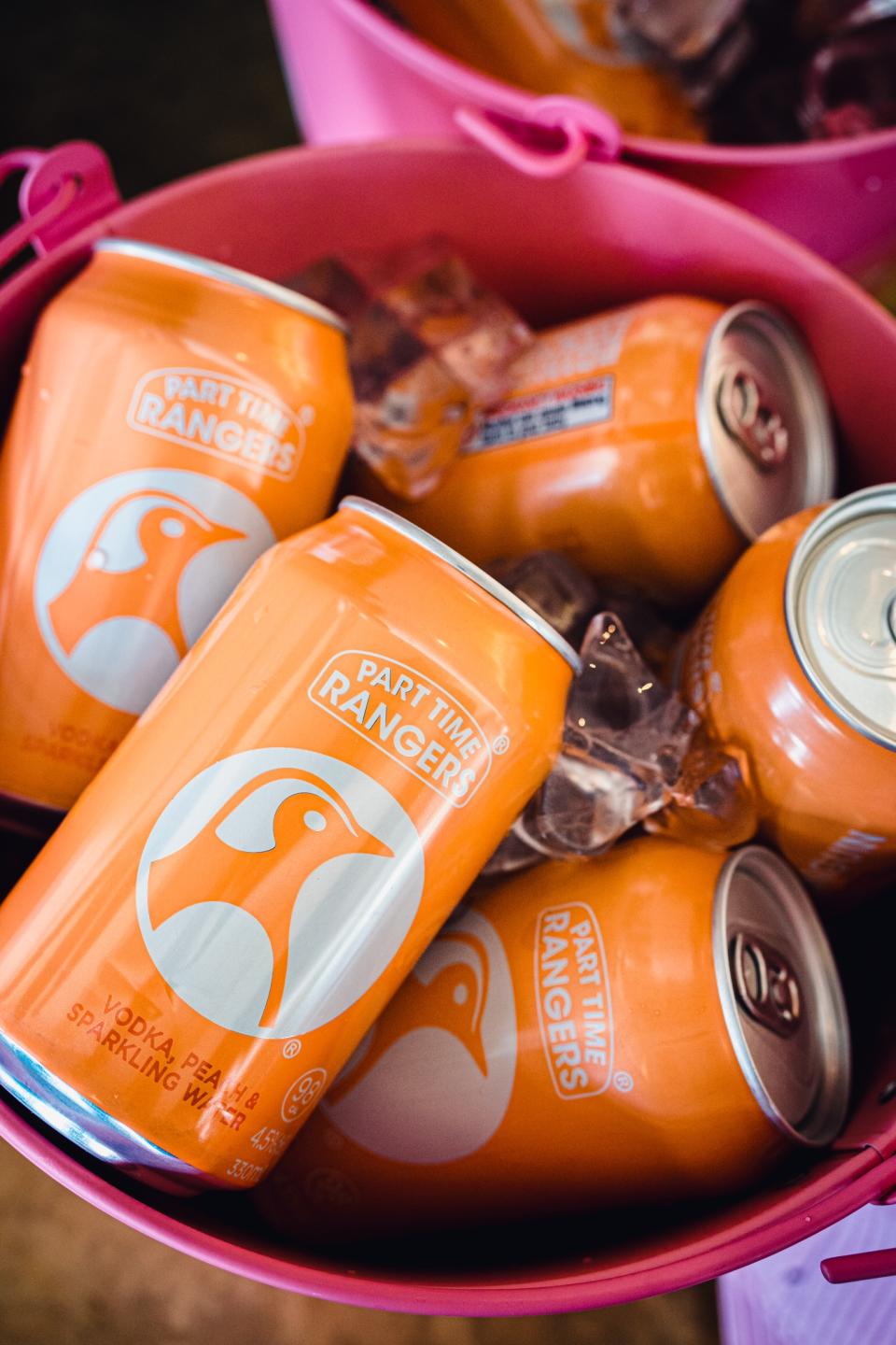 Part Time Rangers Peach Penguin cans in a bucket