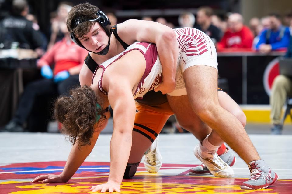 Central York's Macon Myers (back) wrestles Pottsville's Terrell Mcfarland in a 172-pound first round bout at the PIAA Class 3A Wrestling Championships at the Giant Center on March 9, 2023, in Derry Township. Myers won by fall at 2:24. 