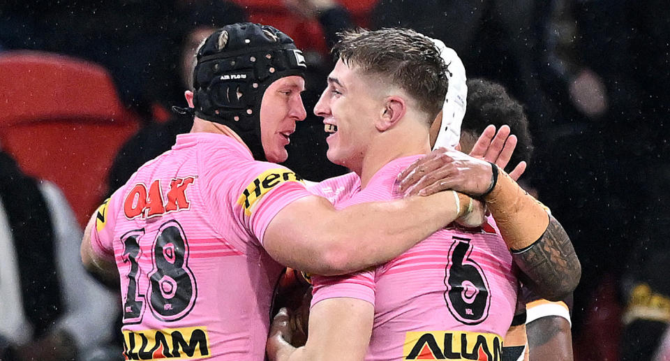 Penrith Panthers players celebrate a try in their NRL victory against the Broncos. Pic: Getty