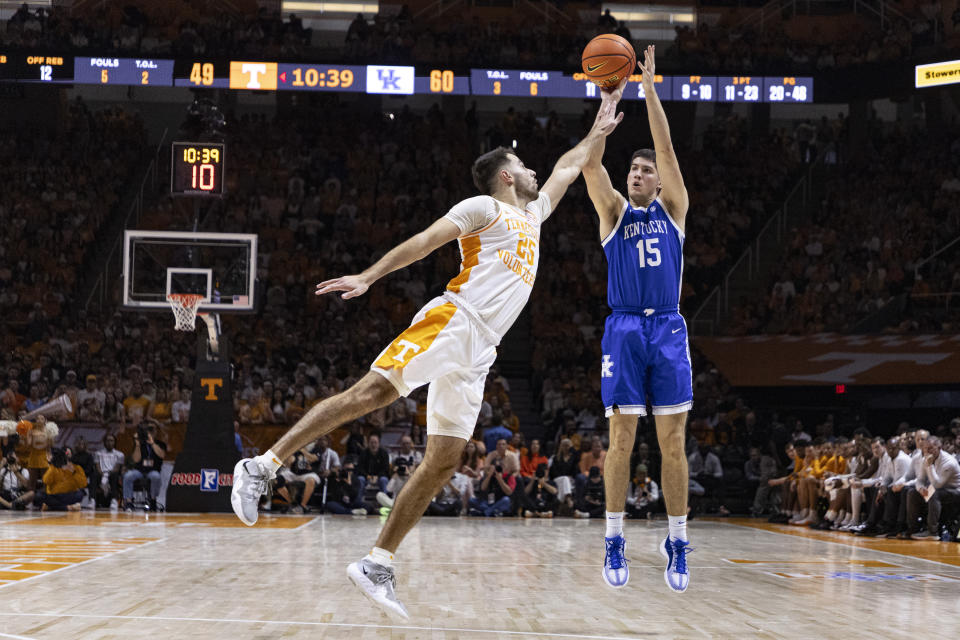 Kentucky guard Reed Sheppard (15) shoots over Tennessee guard Santiago Vescovi (25) during the second half of an NCAA college basketball game Saturday, March 9, 2024, in Knoxville, Tenn. (AP Photo/Wade Payne)