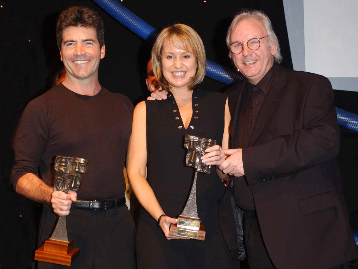 Pop Idol judges from left to right; Simon Cowell, Nicki Chapman and Pete Waterman with their TV entertainment programme of the award during the 2002 TRIC (Television & Radio Industries Club) Awards at the Le Meridien Grosvenor House Hotel in London.