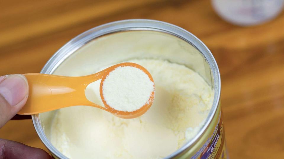 PHOTO: Powder milk and blue spoon on light background close-up. Milk powder for baby in measuring spoon on can in an undated stock photo. (Sod Tatong/Getty Images)