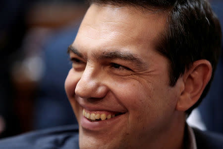 FILE PHOTO: Greek Prime Minister Alexis Tsipras smiles during a session of the ruling Syriza party parliamentary group at the parliament in Athens, Greece May 5, 2017. REUTERS/Alkis Konstantinidis/File Photo
