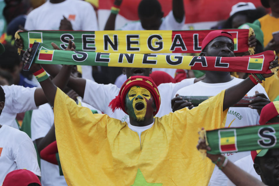 Senegal\s fans cheer before the African Cup of Nations final soccer match between Algeria and Senegal in Cairo International stadium in Cairo, Egypt, Friday, July 19, 2019. (AP Photo/Hassan Ammar)