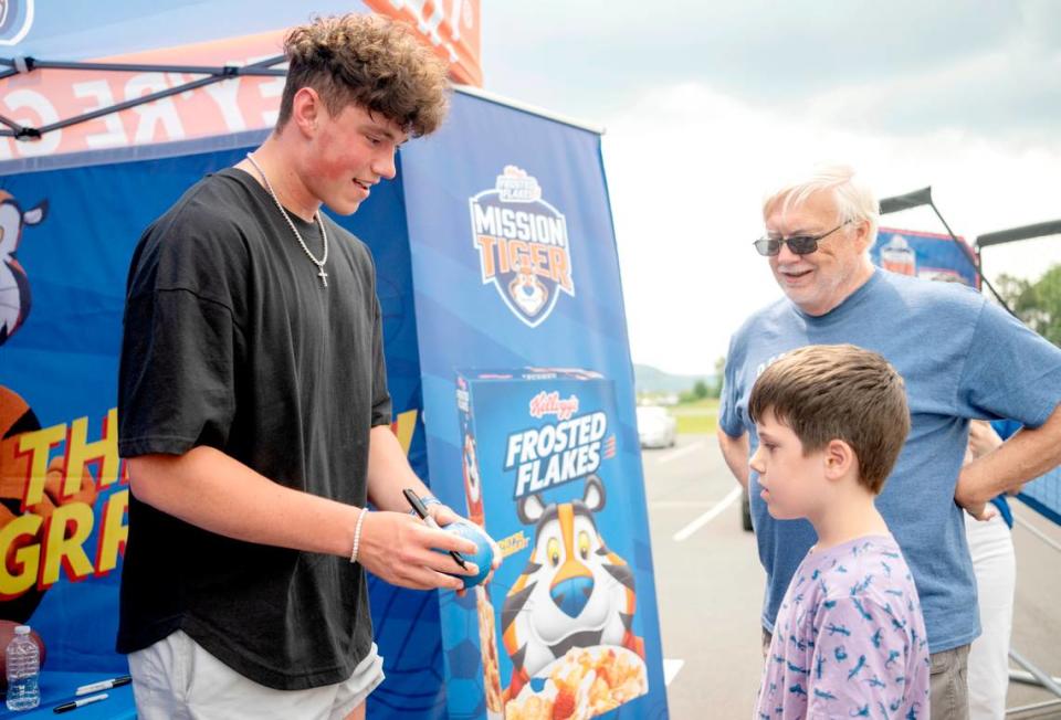 Penn State quarterback Drew Allar signs autographs for fans after teaming up with Kellogg’s Frosted Flakes and Mission Tiger Project outside of the Giant on Bender Pike on Wednesday, July 12, 2023. Abby Drey/adrey@centredaily.com