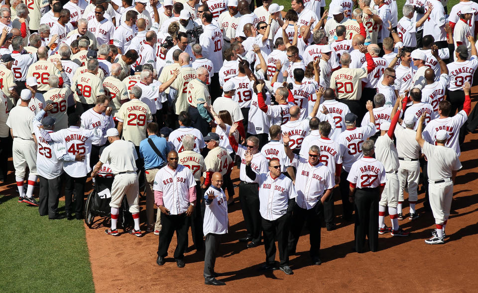 BOSTON, MA - APRIL 20: Former Boston Red Sox players, coaches and managers wave to the fans in a ceremony before the game between the New York Yankees and the Boston Red Sox on April 20, 2012 at Fenway Park in Boston, Massachusetts. Today marks the 100 year anniversary of the ball park's opening. (Photo by Elsa/Getty Images)