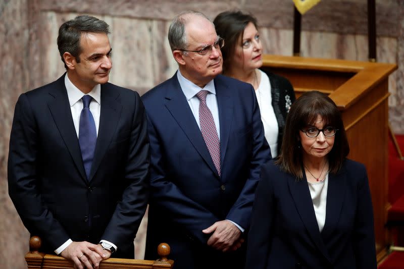 Newly elected Greek President Sakellaropoulou, Greece's Prime Minister Mitsotakis and the Spokesman of the Greek Parliament Tasoulas, attend the swearing-in ceremony at the parliament in Athens