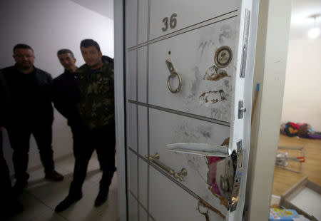 The door of a hideout where the alleged attacker of Reina nightclub was caught by Turkish police last night, is pictured at Esenyurt neighborhood in Istanbul, Turkey. REUTERS/Osman Orsal