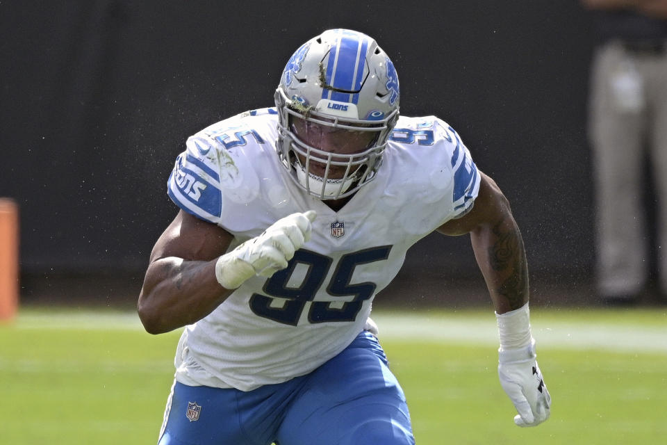 FILE - Detroit Lions defensive end Romeo Okwara (95) follows a play during the first half of an NFL football game against the Jacksonville Jaguars in Jacksonville, Fla., in this Sunday, Oct. 18, 2020, file photo. A person familiar with the situation says defensive end Romeo Okwara has agreed to stay with the Detroit Lions. The person spoke Monday, March 15, 2021, on condition of anonymity because the team had not announced the deal. (AP Photo/Phelan M. Ebenhack, File)