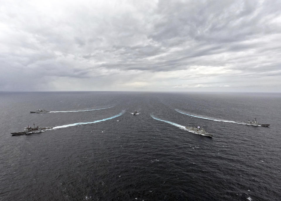 In this photo provided by South Korea Defense Ministry, the USS Robert Smalls cruiser, bottom left, South Korean Navy's Yulgok Yi I destroyer, bottom right, South Korean Navy's Dae Jo Yeong destroyer, top left, combat support ship Cheonji, center, and the USS Shoup destroyer sail during a joint naval exercise in South Korea's East Sea, Monday, Sept. 25, 2023. North Korea on Monday called South Korean President Yoon Suk Yeol 