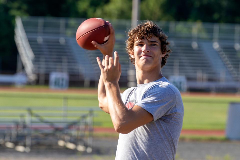 Connor Dietz, quarterback, warms up his arm during Brick Memorial High School football practice at Brick Memorial High School in Brick, NJ Monday, August 8, 2022.