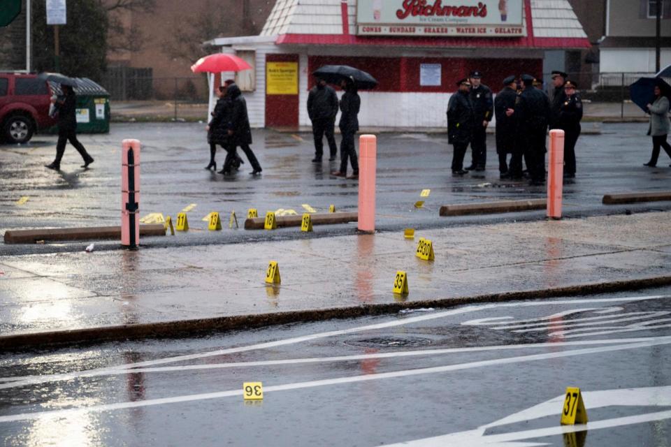 PHOTO: Evidence markers are seen following a shooting in Northeast Philadelphia, March 6, 2024. (Joe Lamberti/AP)