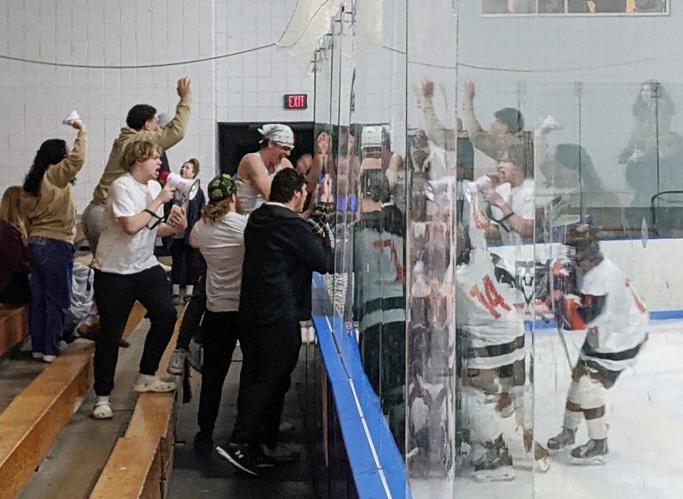Only the boards and the glass could separate the Gardner/Murdock boys ice hockey team from celebrating with their fellow classmates and fans following the Wildcats' 5-2 victory over St. Bernard's in a Central Mass. Class C semifinal, Wednesday, at Veterans Arena in Gardner.