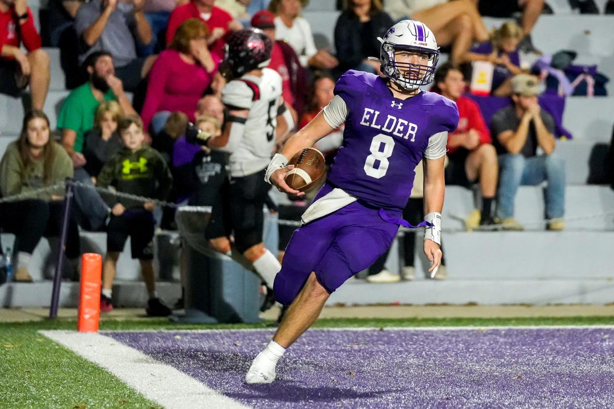 Elder Panthers quarterback Ryan Brass (8) scores a touchdown during the OHSAA first-round playoff game between neighborhood rivals Oak Hills Highlanders and Elder Panthers on Friday, Oct. 27, 2023, at Elder High School in West Price Hill. Elder won 28-14.