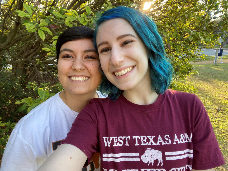 This Aug. 15, 2022, photo shows El Johnson, right, with her girlfriend, Sara Goodie, in Austin, Texas. Johnson has decided not to bear children, though she hasn’t ruled out adoption. The birth rate in the U.S. has dropped dramatically as more young people decide not to have children. (El Johnson via AP)