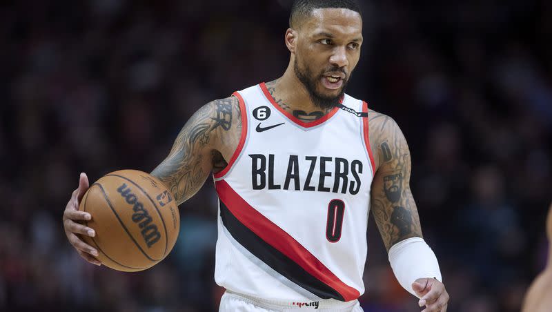 Portland Trail Blazers guard Damian Lillard brings the ball up against the New York Knicks in Portland, Ore., Tuesday, March 14, 2023. Where for the former Weber State star lands will have a ripple effect around the league.