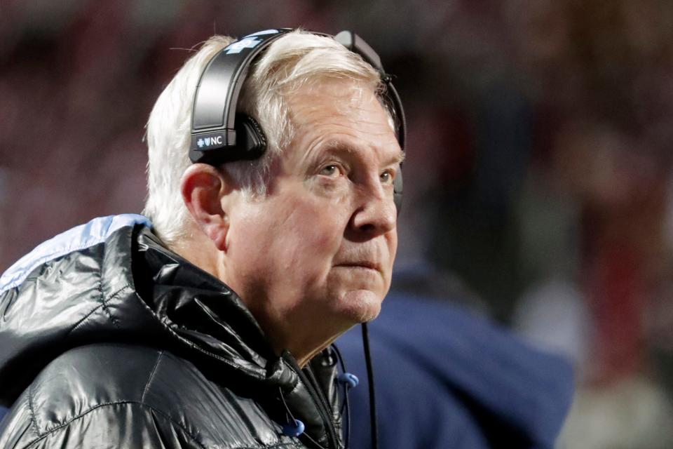 North Carolina coach Mack Brown watches a replay during Friday night’s game against rival N.C. State at Carter-Finley Stadium.