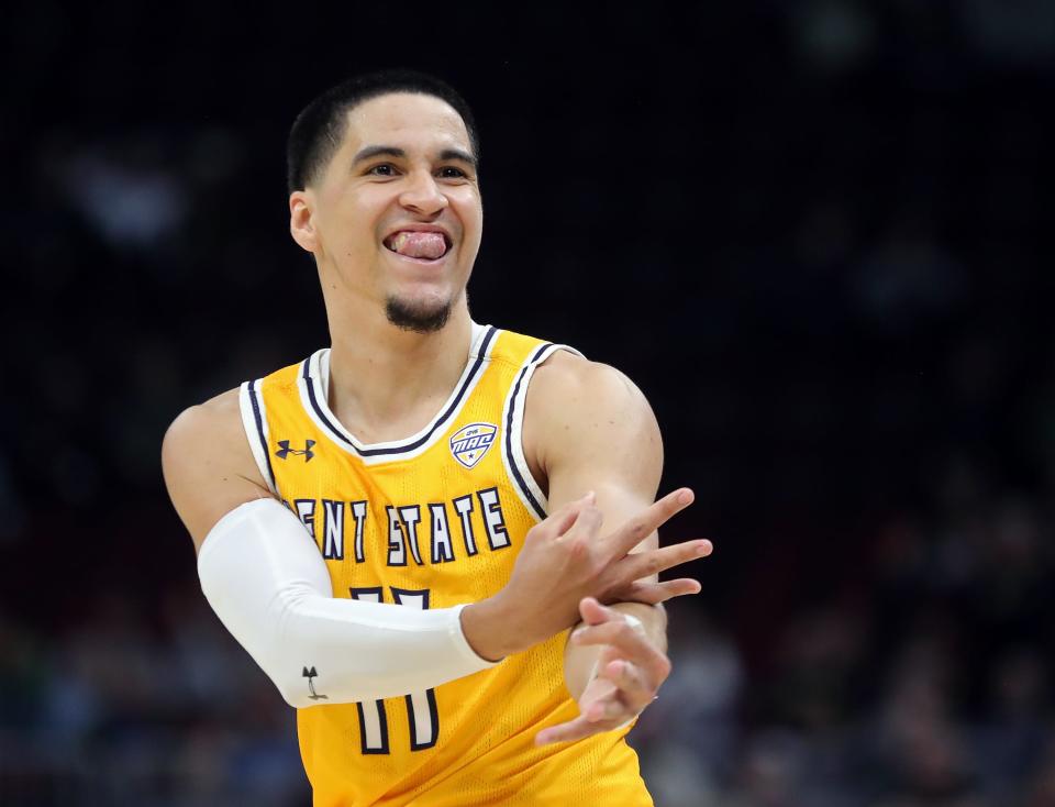 Kent State's Giovanni Santiago (11) celebrates after a 3-pointer against Bowling Green during the second half of a Mid-American Conference Tournament semifinal Friday, March 15, 2024, at Rocket Mortgage FieldHouse in Cleveland.