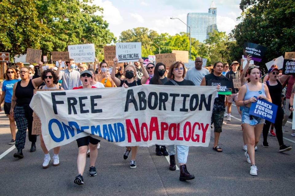 Hundreds of demonstrators rally and march in downtown Raleigh Friday, June, 24, 2022 in opposition to the U.S. Supreme Court’s decision to overturn its landmark Roe v. Wade ruling.