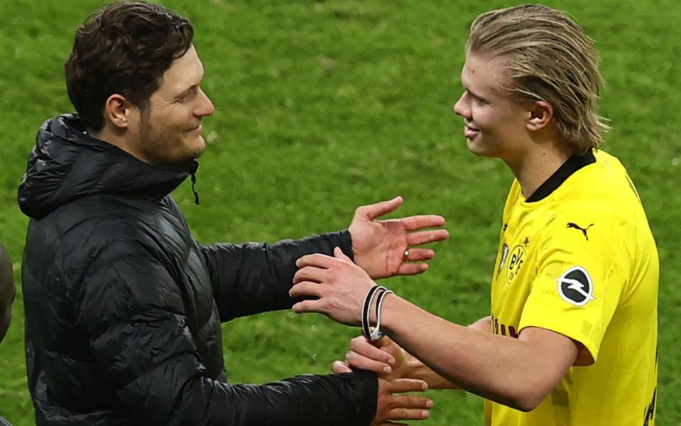 Erling Haaland is greeted by Edin Terzic as he leaves the pitch during the 2021 German Cup Final between RB Leipzig and Borussia Dortmund