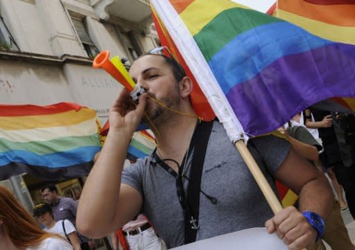 A demonstrator blows a horn as he takes part to the Gay Pride parade in the Adriatic port of Split. Hundreds of riot police were on guard Saturday as Croatia's second city hosted a gay parade seen as a test of tolerance in the EU-bound country after violence last year left a dozen people injured