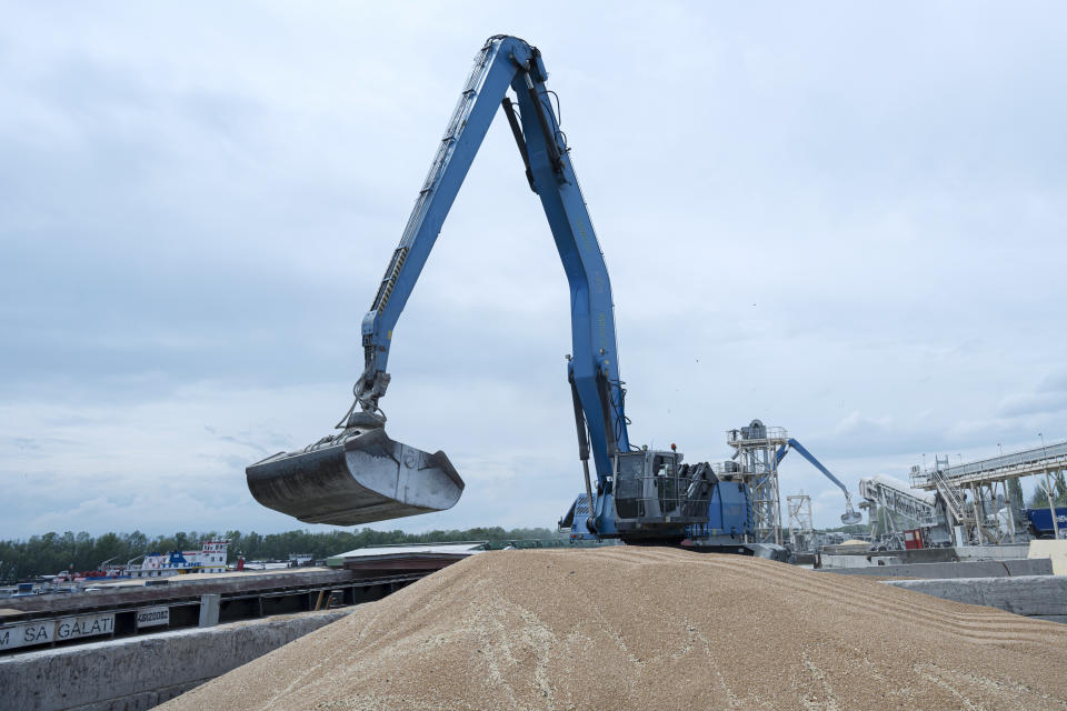 FILE - An excavator loads grain into a cargo ship at a grain port in Izmail, Ukraine, on April 26, 2023. Russia has suspended on Monday July 17, 2023 a wartime deal brokered by the U.N. and Turkey that was designed to move food from Ukraine to parts of the world where millions are going hungry. (AP Photo/Andrew Kravchenko, File)