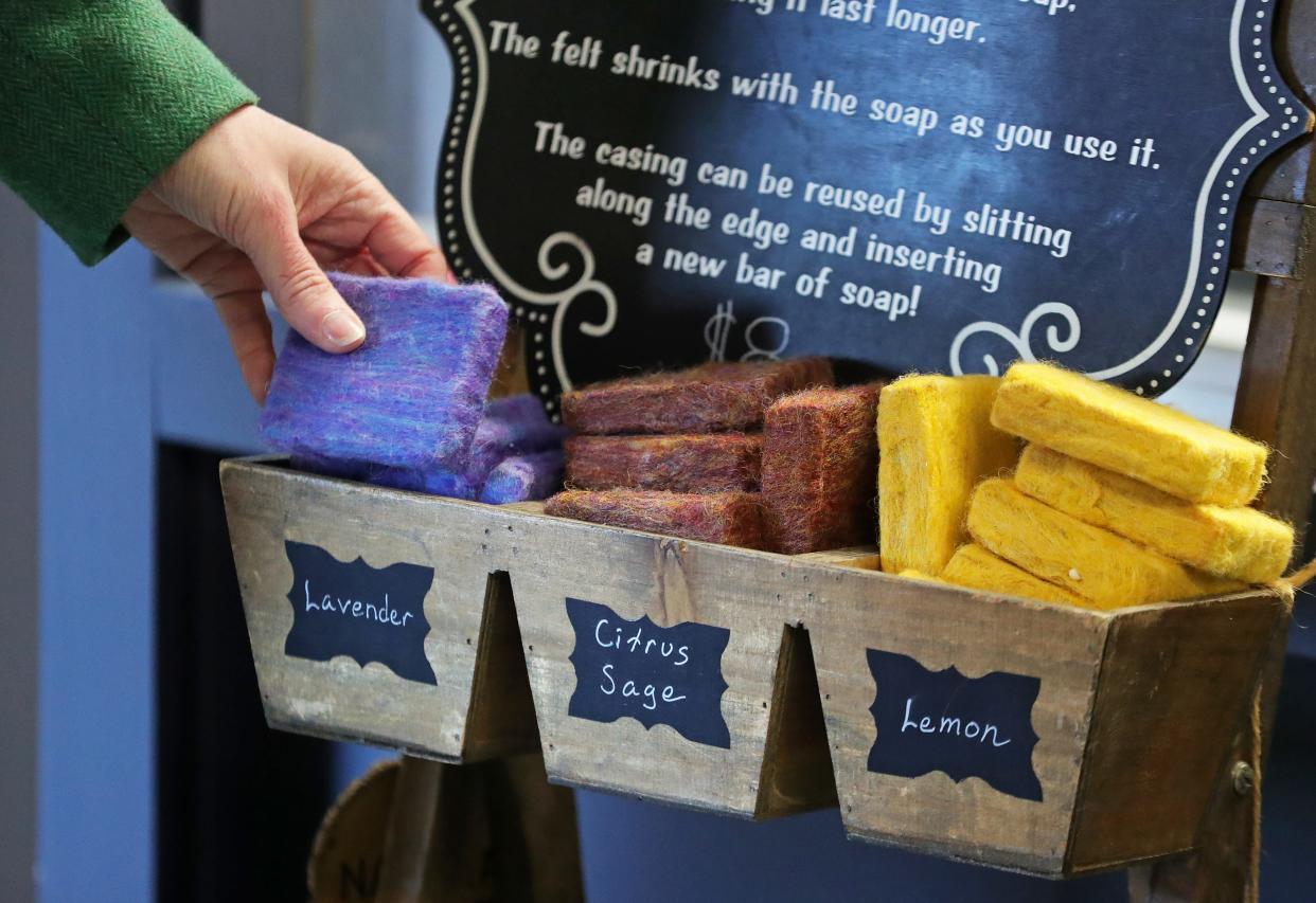 Jennifer Couch, owner of JENCI, talks about the felt soap washcloths she sells at her new storefront Market on Main, located at 159 S. Main St. in downtown Akron.