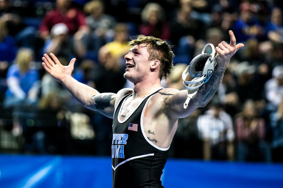 Upper Iowa's Chase Luensman celebrates his championship at 165 pounds during the NCAA Division II Wrestling Championships on Saturday in Cedar Rapids.