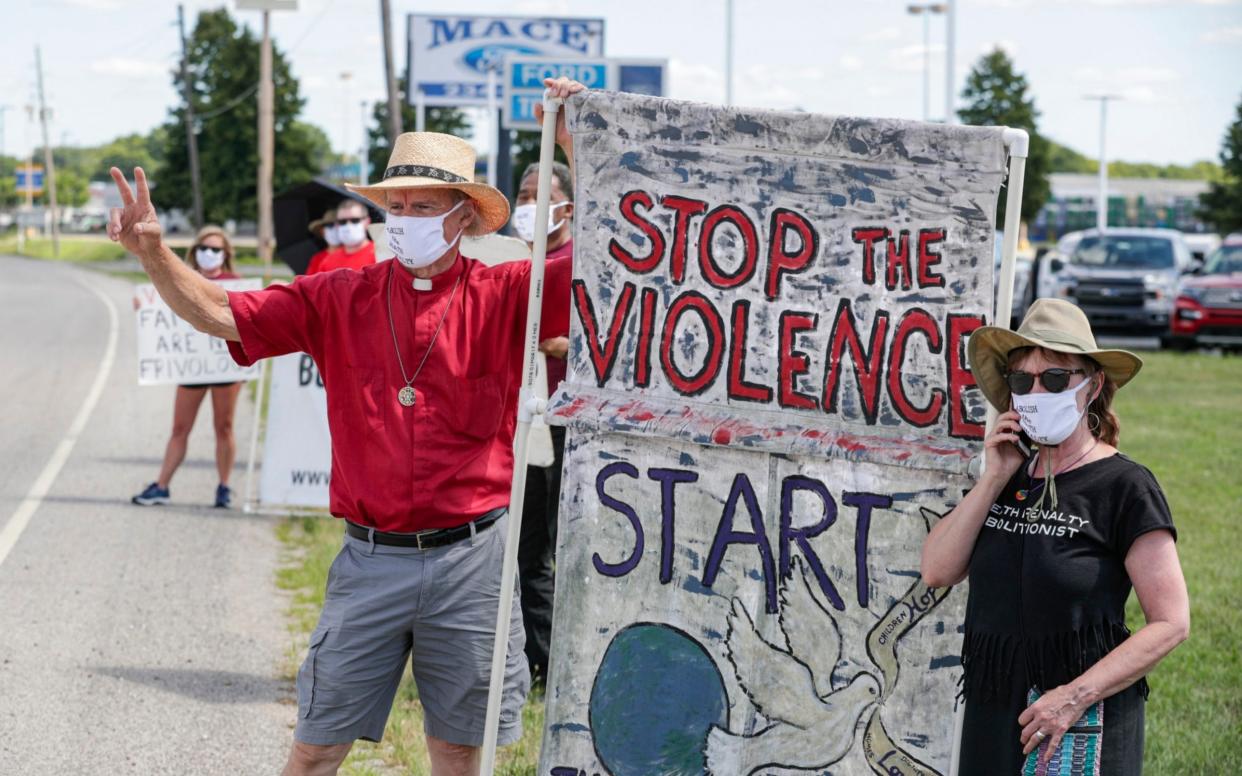 Protesters against the death penalty gather in Terre Haute, Indiana - AP