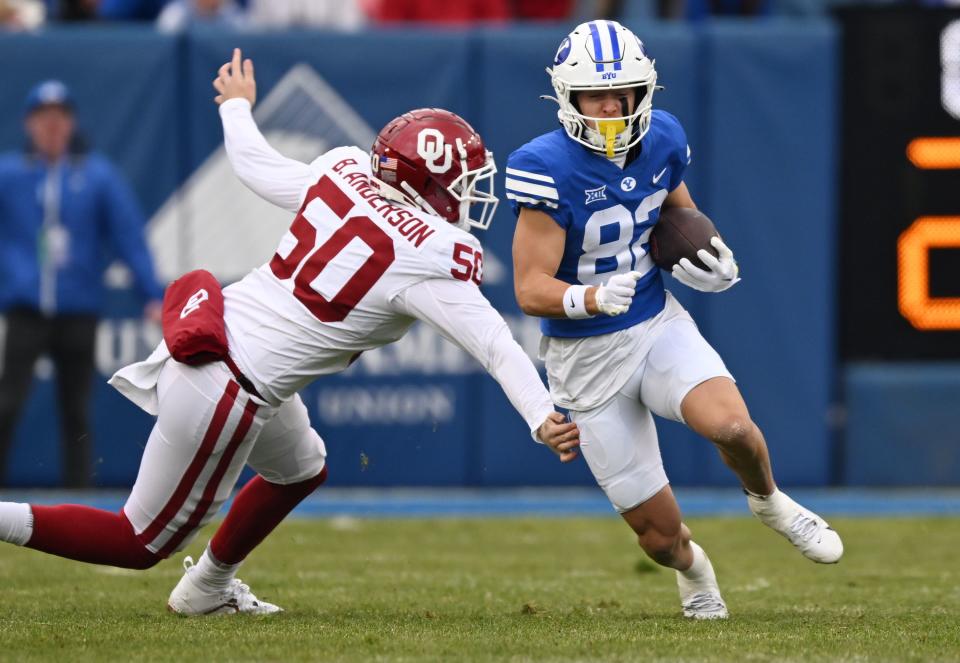 Brigham Young Cougars wide receiver Parker Kingston (82) avoids Oklahoma Sooners linebacker Phil Picciotti (50) on a kick return as BYU and Oklahoma play at LaVell Edwards Stadium in Provo on Saturday, Nov. 18, 2023. | Scott G Winterton, Deseret News