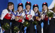 Gold medallists Canada's Jennifer Jones, Kaitlyn Lawes, Jill Officer, Dawn McEwen and Kirsten Wall (R-L) pose during the victory ceremony for the women's curling competition at the 2014 Sochi Winter Olympics February 22, 2014. REUTERS/Shamil Zhumatov (RUSSIA - Tags: OLYMPICS SPORT CURLING)