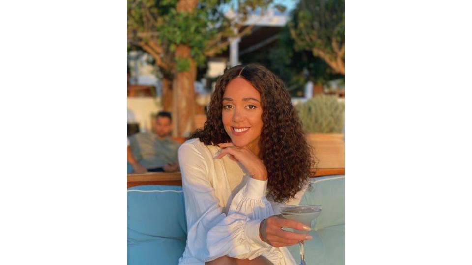 Katharina Johnson-Thompson sitting at an outside restaurant