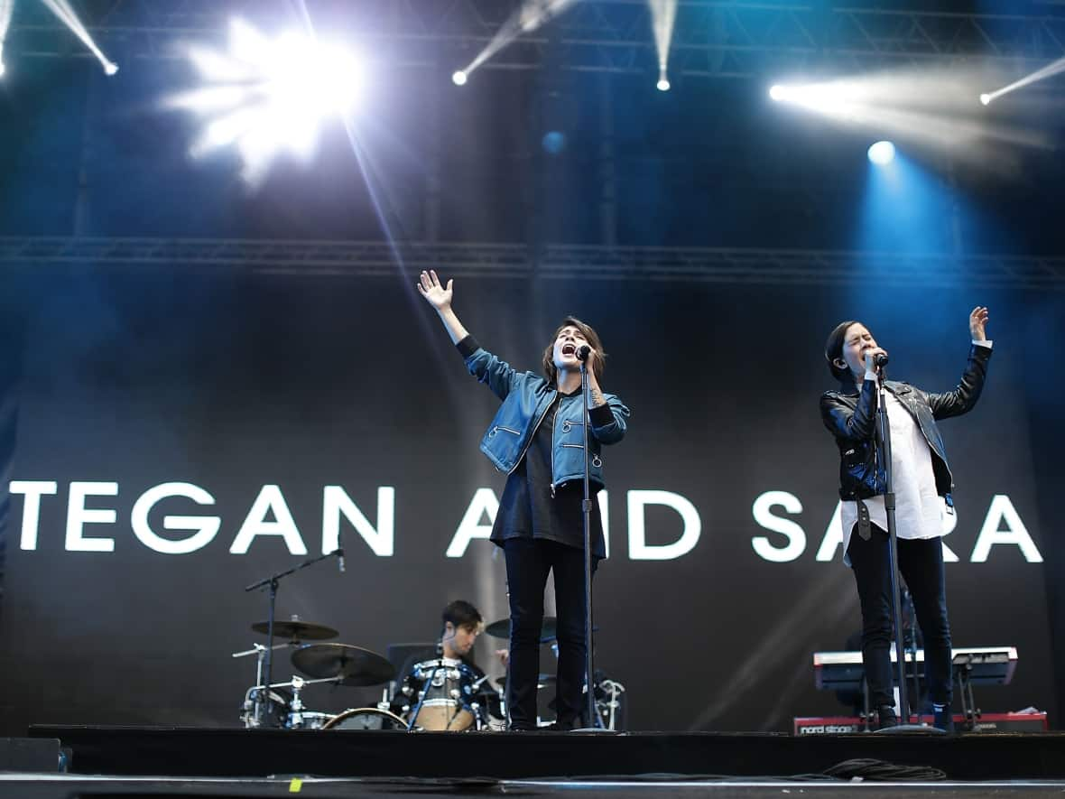 Tegan and Sara perform during Splendour in the Grass 2016 on July 24, 2016 in Byron Bay, Australia. Their joint memoir, which is being adapted into a TV series, follows their upbringing in Calgary. (Photo by Mark Metcalfe/Getty Images - image credit)