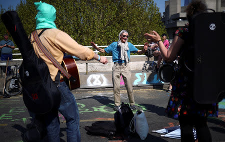 Climate change activists attend the Extinction Rebellion protest in London, Britain April 21, 2019. REUTERS/Hannah McKay