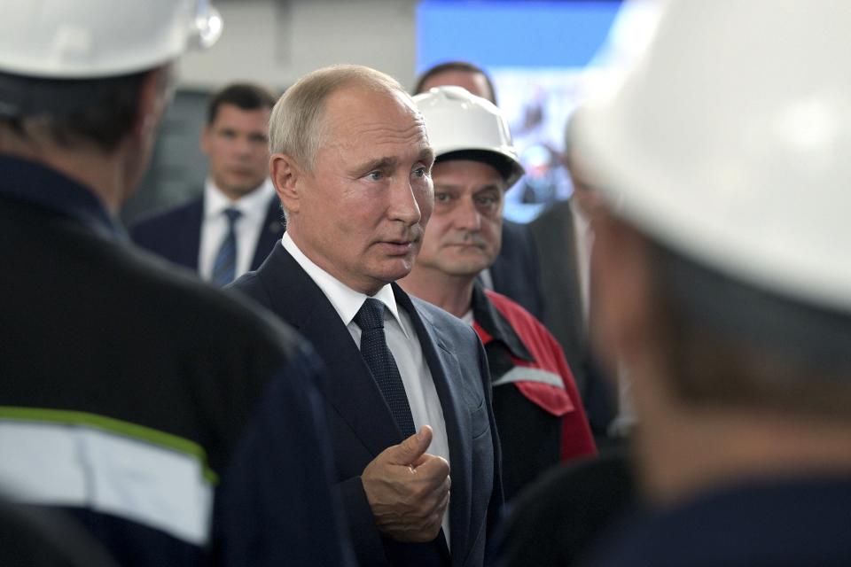 Russian President Vladimir Putin speaks to workers at the Zaliv shipyard in Kerch, Crimea, Monday, July 20, 2020. Russian President Vladimir Putin on Monday supported postponing The Immortal Regiment, a mass procession that was supposed to mark the 75th anniversary of the defeat of Nazi Germany in World War II, until next year because of the coronavirus pandemic. (Alexei Druzhinin, Sputnik, Kremlin Pool Photo via AP)