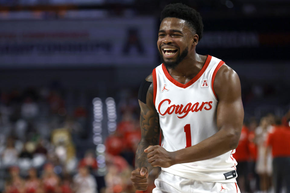 Houston guard Jamal Shead (1) reacts after a basket against Cincinnati during the first half of an NCAA college basketball game in the semifinals of the American Athletic Conference Tournament, Saturday, March 11, 2023, in Fort Worth, Texas. (AP Photo/Ron Jenkins)
