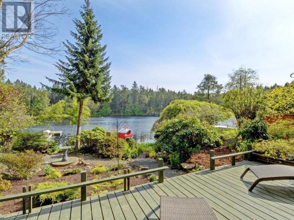 <p><a rel="nofollow noopener" href="https://www.zoocasa.com/victoria-bc-real-estate/5299650-673-lost-lake-rd-victoria-bc-v9b6e3-391548" target="_blank" data-ylk="slk:673 Lost Lake Rd., Victoria, B.C.;elm:context_link;itc:0;sec:content-canvas" class="link ">673 Lost Lake Rd., Victoria, B.C.</a><br> The property has 100 feet of waterfront, and the lake is private access only with only eight homes on it.<br> (Photo: Zoocasa) </p>