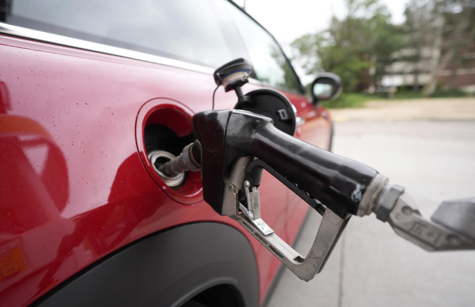 A motorist fills up the tank of a vehicle at a Shell station Wednesday, July 5, 2023, in Englewood, Colo. On Wednesday, the Labor Department issues its consumer prices report for August. (AP Photo/David Zalubowski)