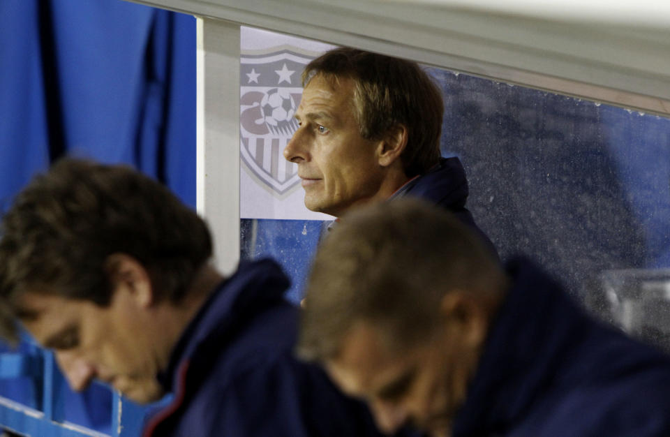 Germans' Juergen Klismann coach of the U.S. soccer team watches the game during an international friendly match against Ukraine at Antonis Papadopoulos stadium in southern city of Larnaca, Cyprus, Wednesday, March 5, 2014. The Ukrainians are facing the United States in a friendly on Wednesday in Cyprus, a match moved from Kharkiv, Ukraine, to Larnaca for security reasons. (AP Photo/Petros Karadjias)