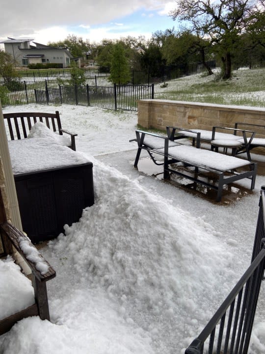 Hail covers an outdoor area off Hamilton Pool Road on March 27, 2024. (ReportIt photo/Steve Allison)