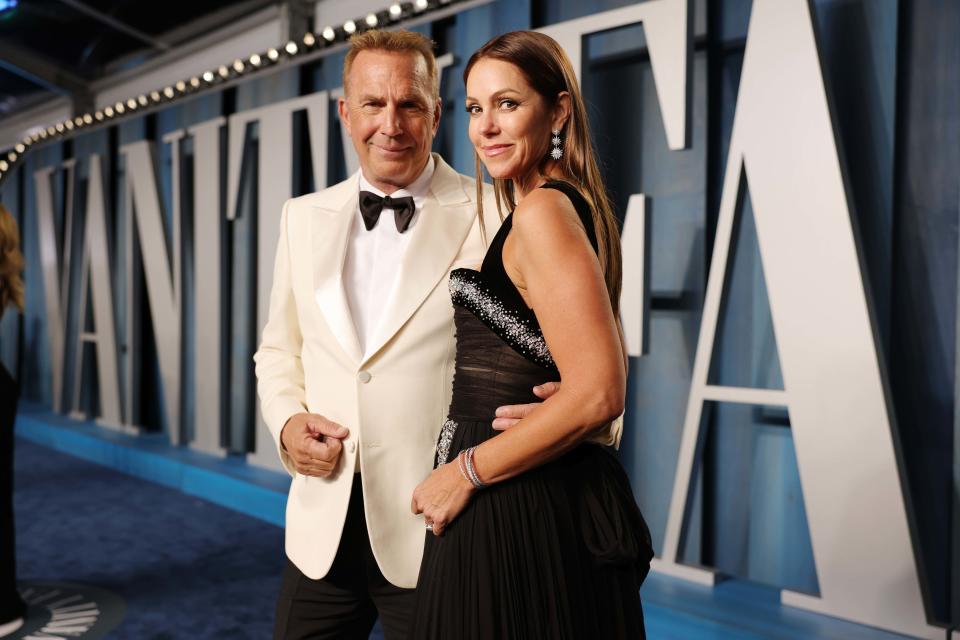 Kevin Costner and Christine Baumgartner  (Rich Fury / Getty Images for Vanity Fair)